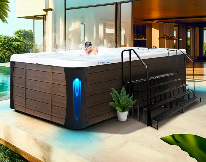 Hot Tubs, Spas, Portable Spas, Swim Spas for Sale  Calspas hot tub being used in a family setting