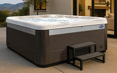 Parents and child in a Cal Spas Patio Plus hot tub