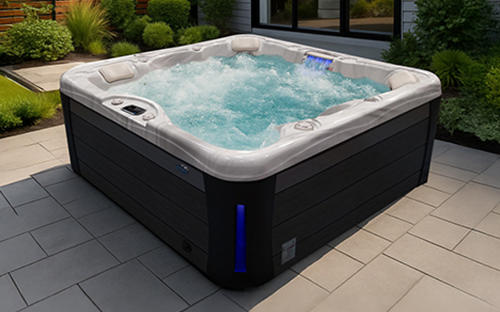 Parents and child in a Cal Spas Patio Plus hot tub